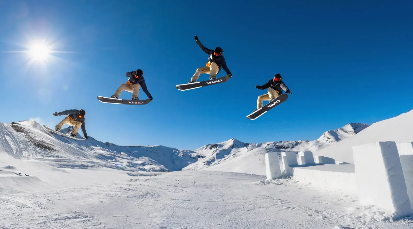 Sequenza di un salto in snowboard nello snowpark di Livigno